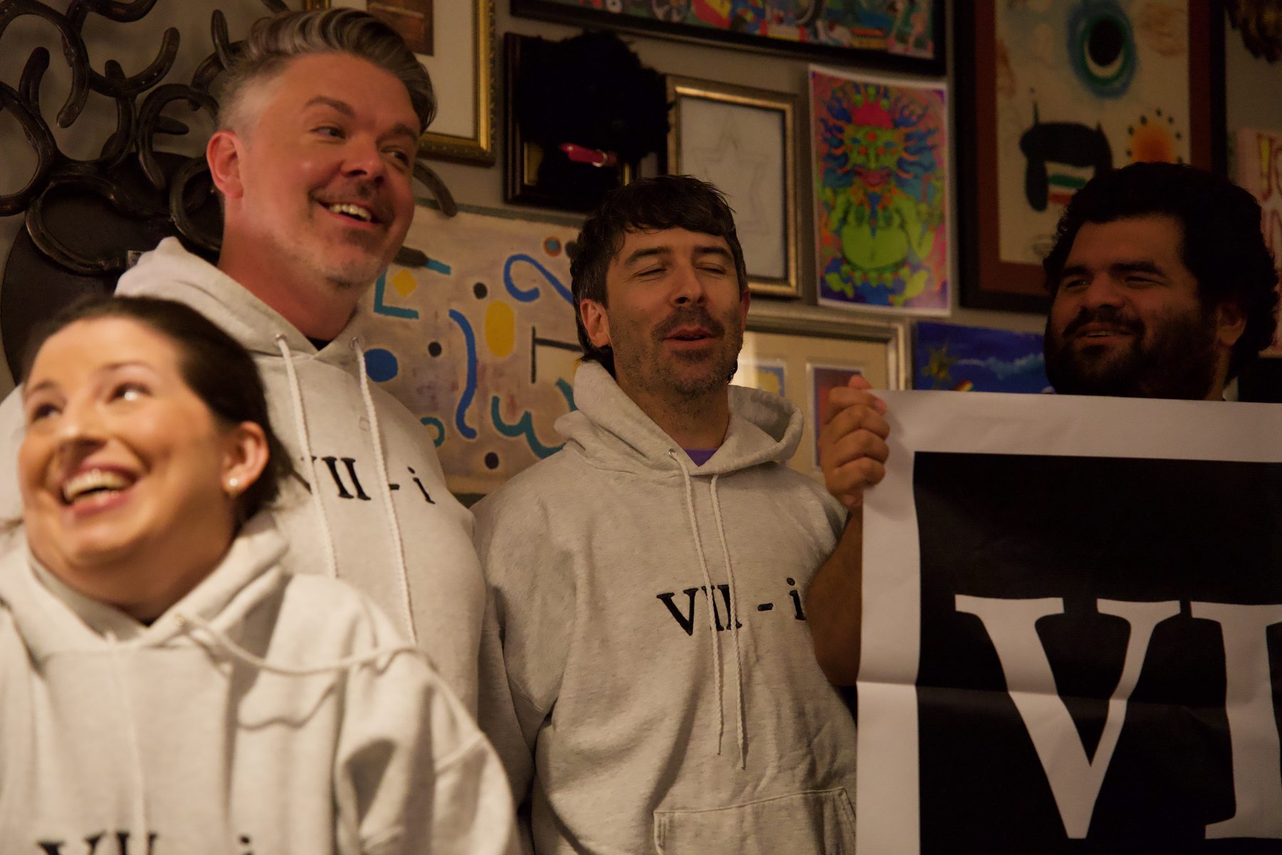 Ensemble members sing together at a gathering