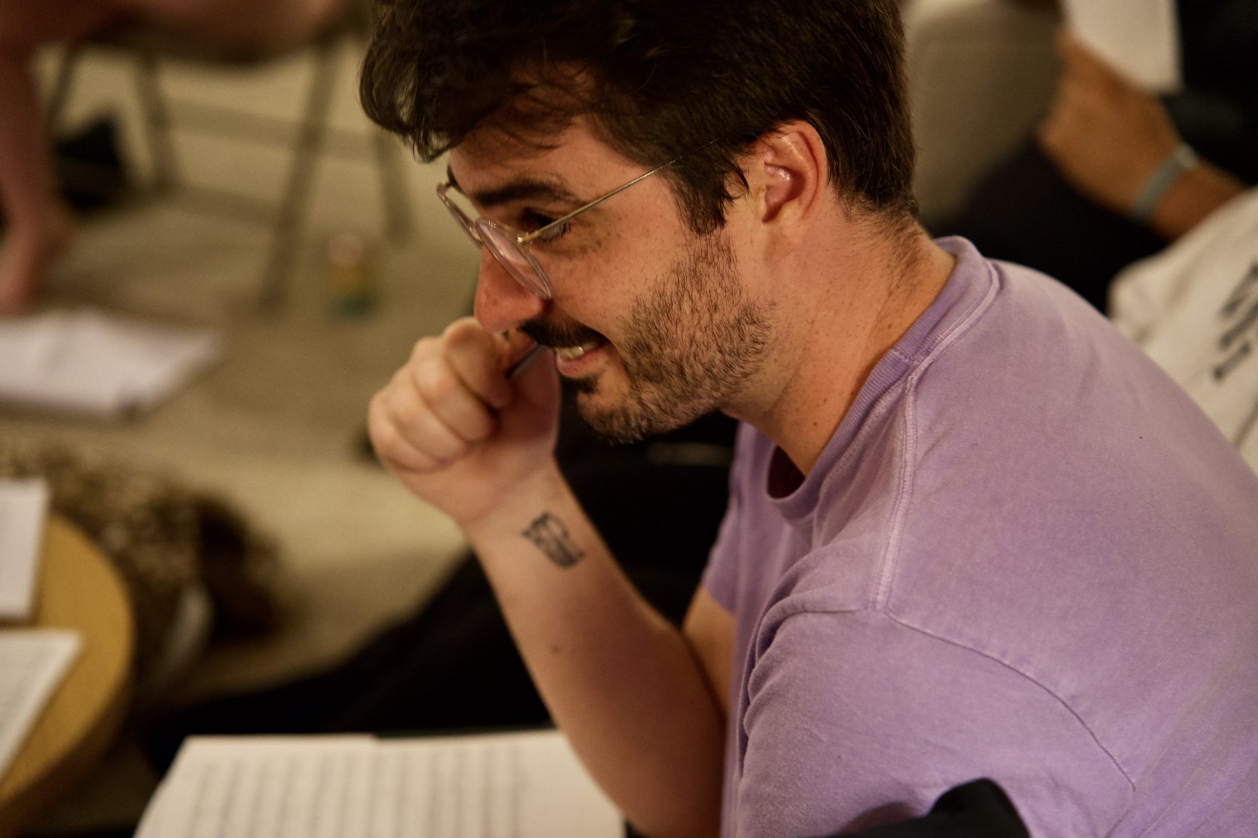 Ensemble member laughs while looking at music